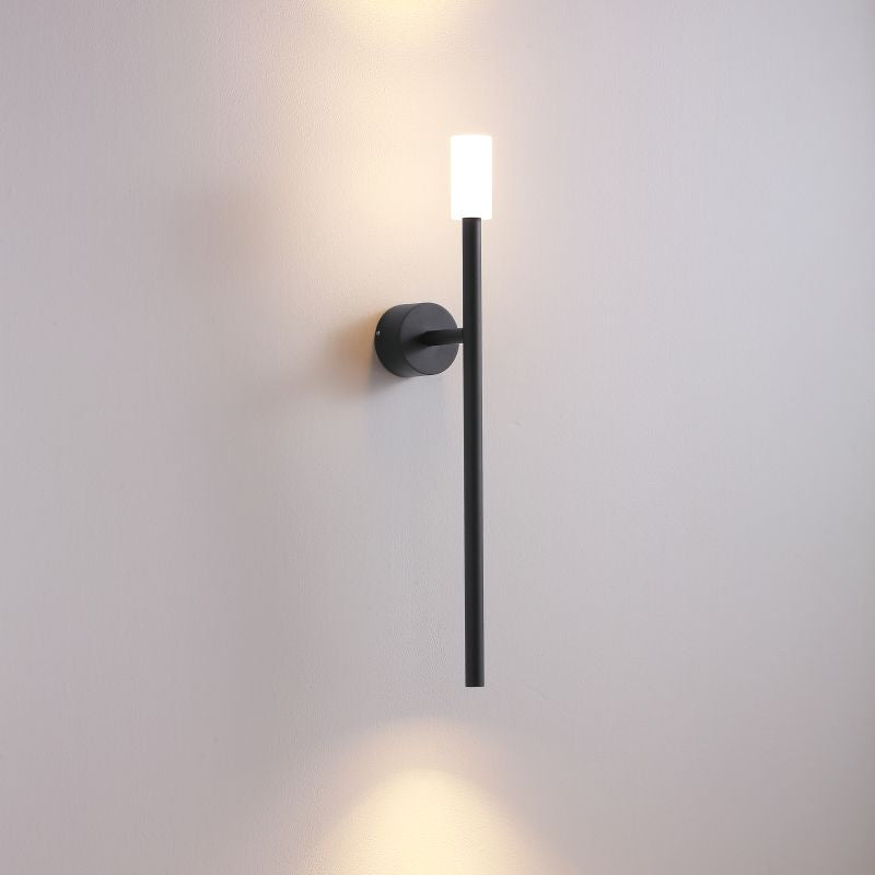 Modern wall-mounted light fixture on a plain wall