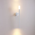 Wall-mounted light fixture on a plain wall