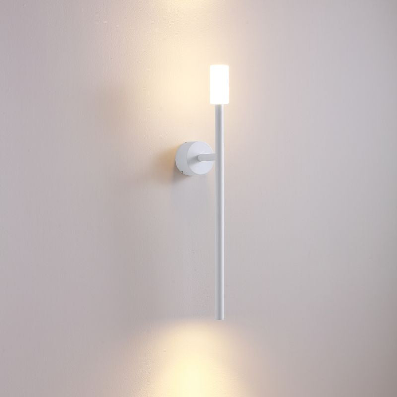 Wall-mounted light fixture on a plain wall